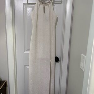 Elegant White Sleeveless Dress with Embellished Neckline
